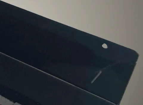 The top corner of a black Hexad, with its keyhole slot.